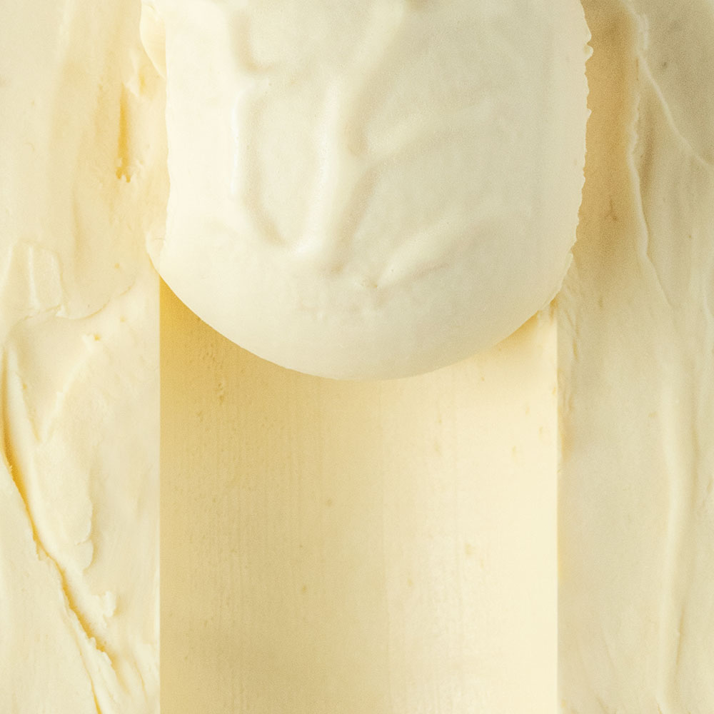 Close-up of half scooped coconut mango gelato