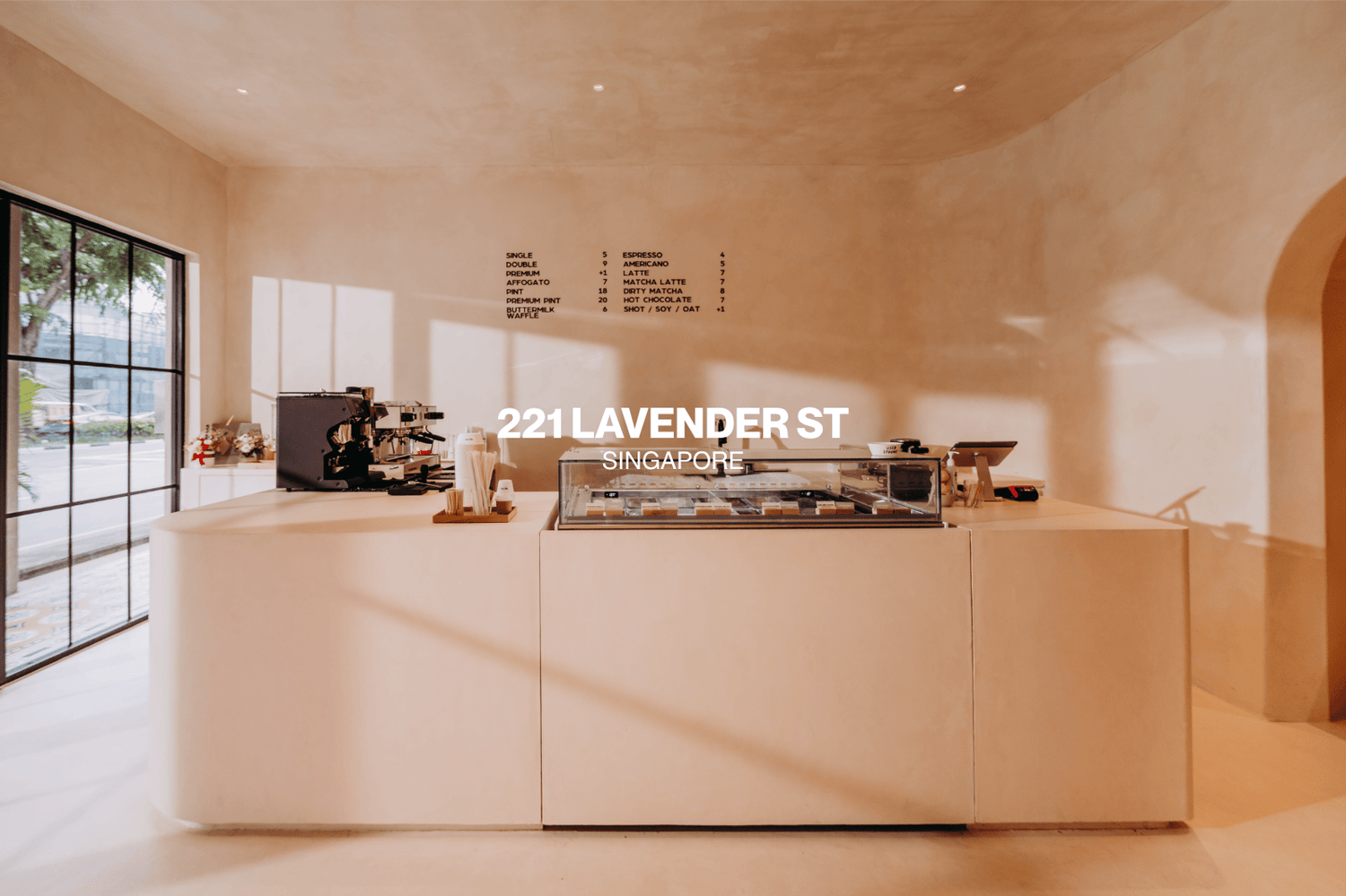 Modern gelato cafe interior with a counter and coffee-making equipment, featuring the address '221 Lavender St Singapore'.